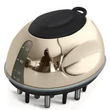 Gold and black scalp massager on a white background